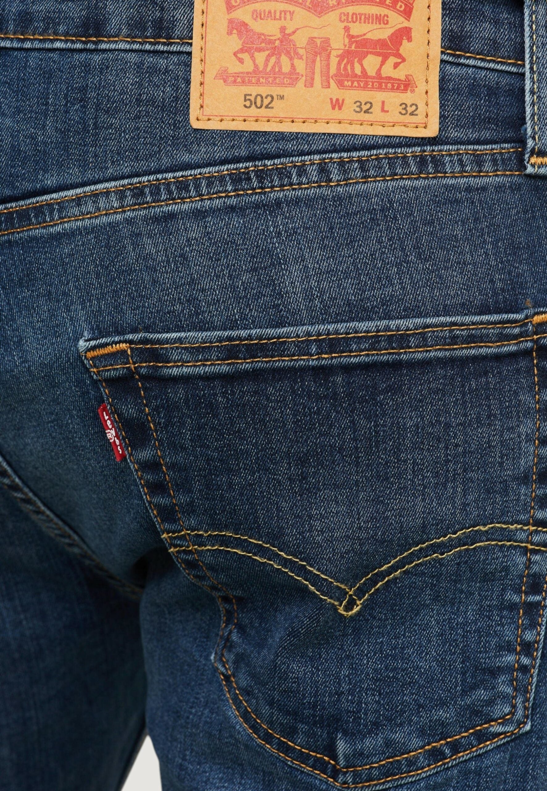 Levi's® メンズ ダークブルー デニム 502 テーパードジーンズ